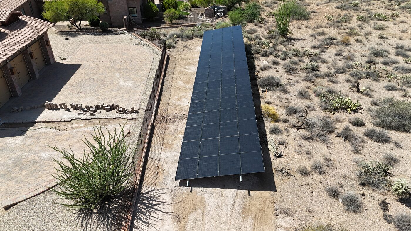 Aerial drone shot of premium ground-mount solar system installed by Imperial Power Solutions